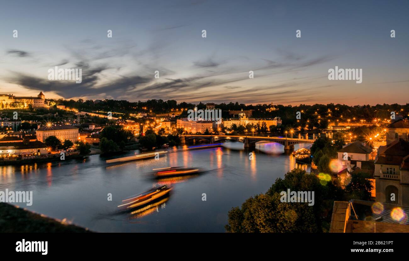 Prague river view during night from the clock tower overlooking charles bridge and castle Stock Photo