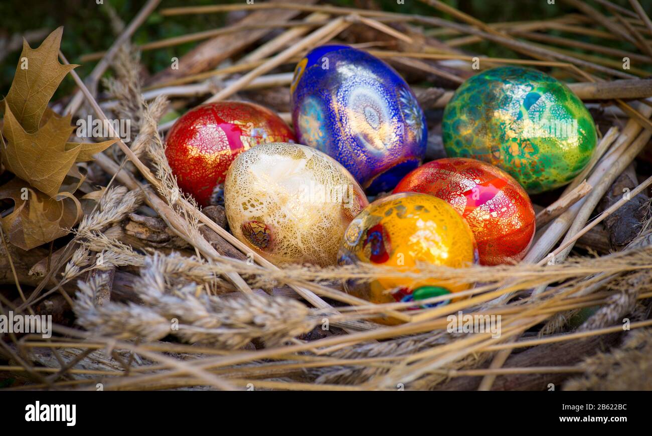 Six colorful painted Easter eggs in a nest Stock Photo - Alamy