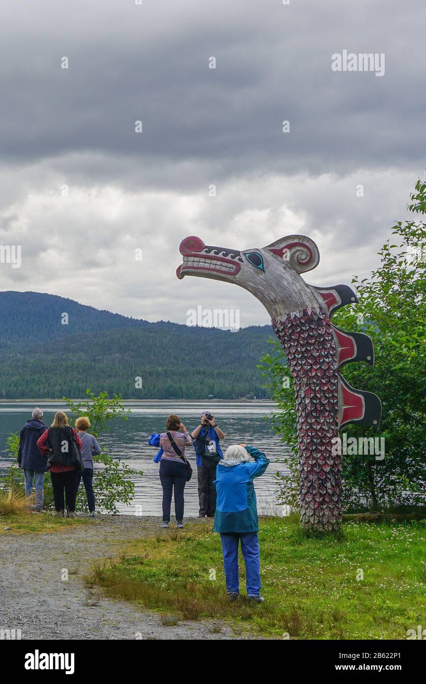 Ketchikan, Alaska Visitors tour the grounds of Potlatch Totem Park, a