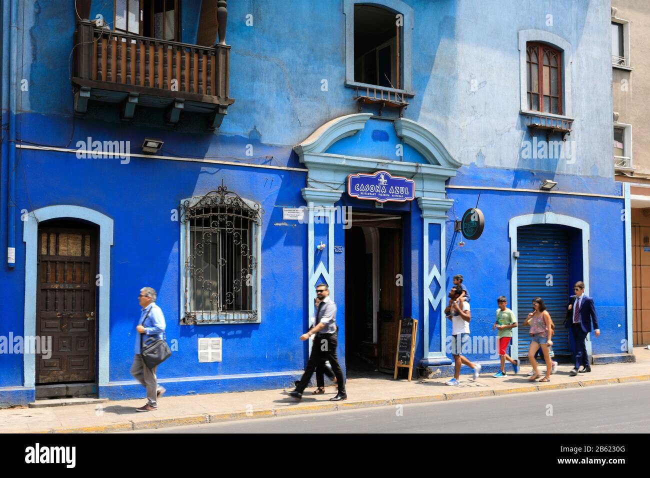 People walking past a bar, Region Metropolitana, Santiago City, Chile Stock Photo