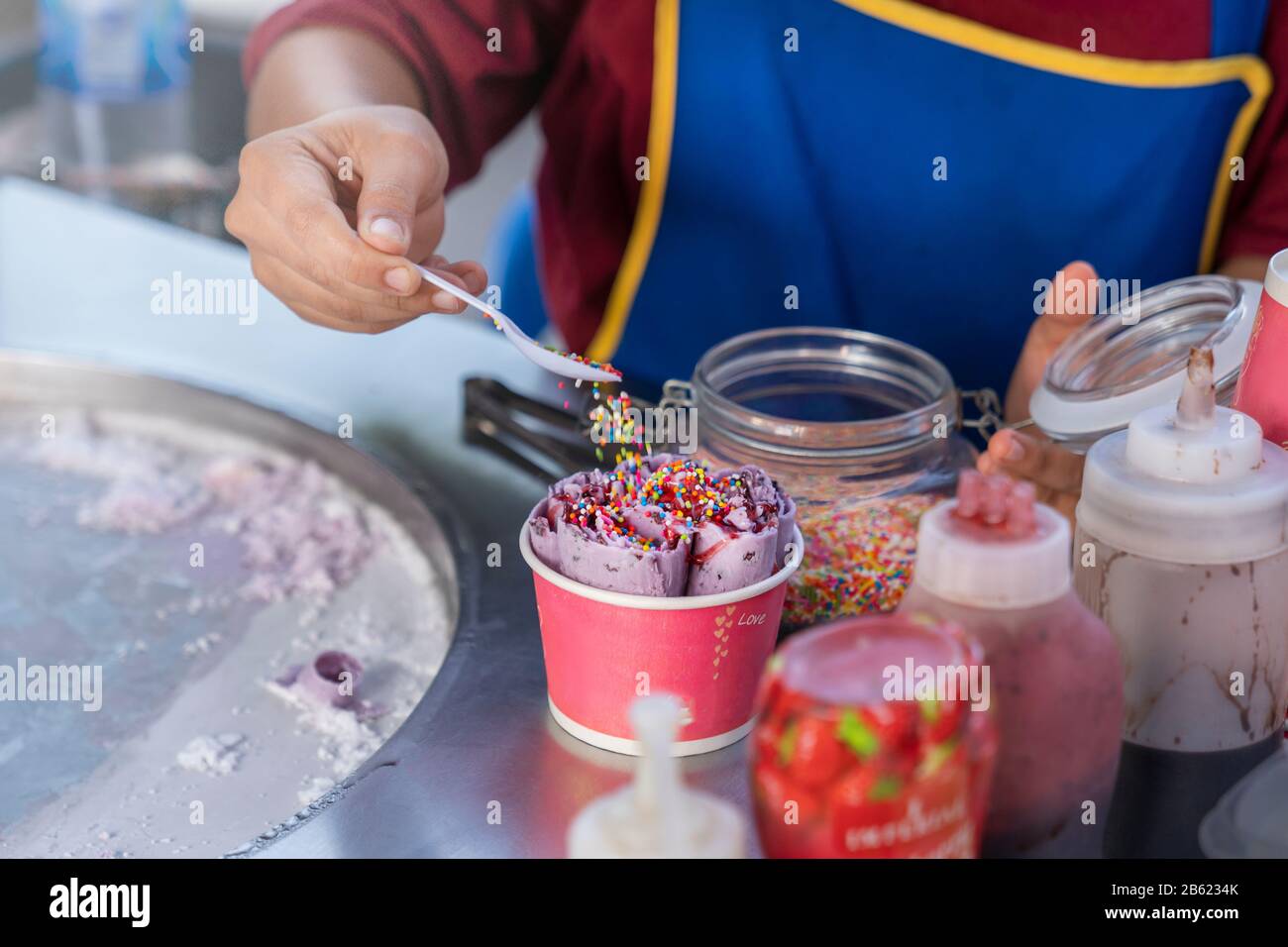 the preparation of icecream , Thai street food, cook sprinkles ice