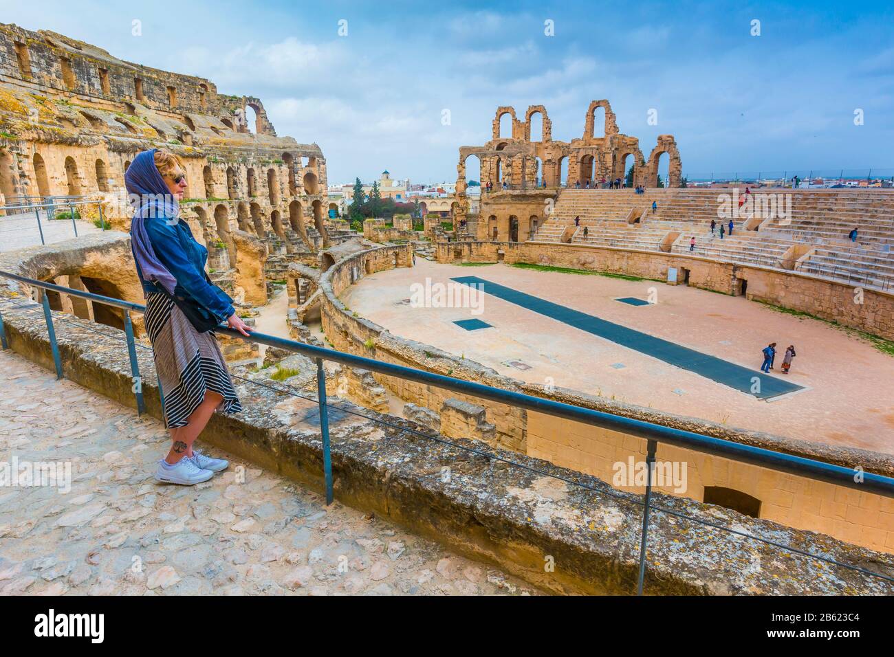 Tourist woman in an amphitheatre of Roman Empire. Stock Photo
