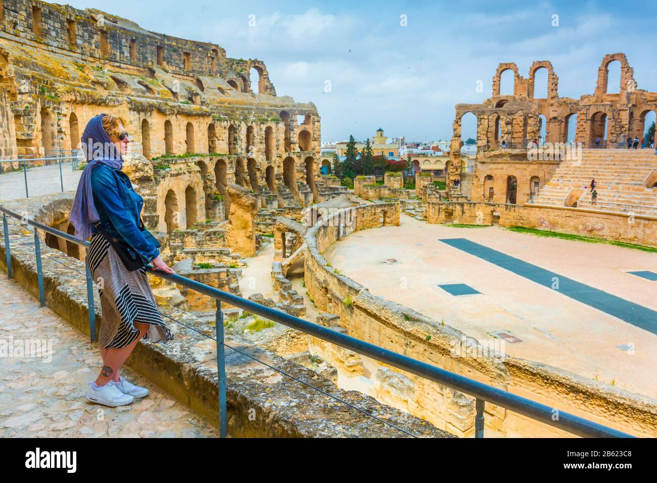 Tourist woman in an amphitheatre of Roman Empire. Stock Photo