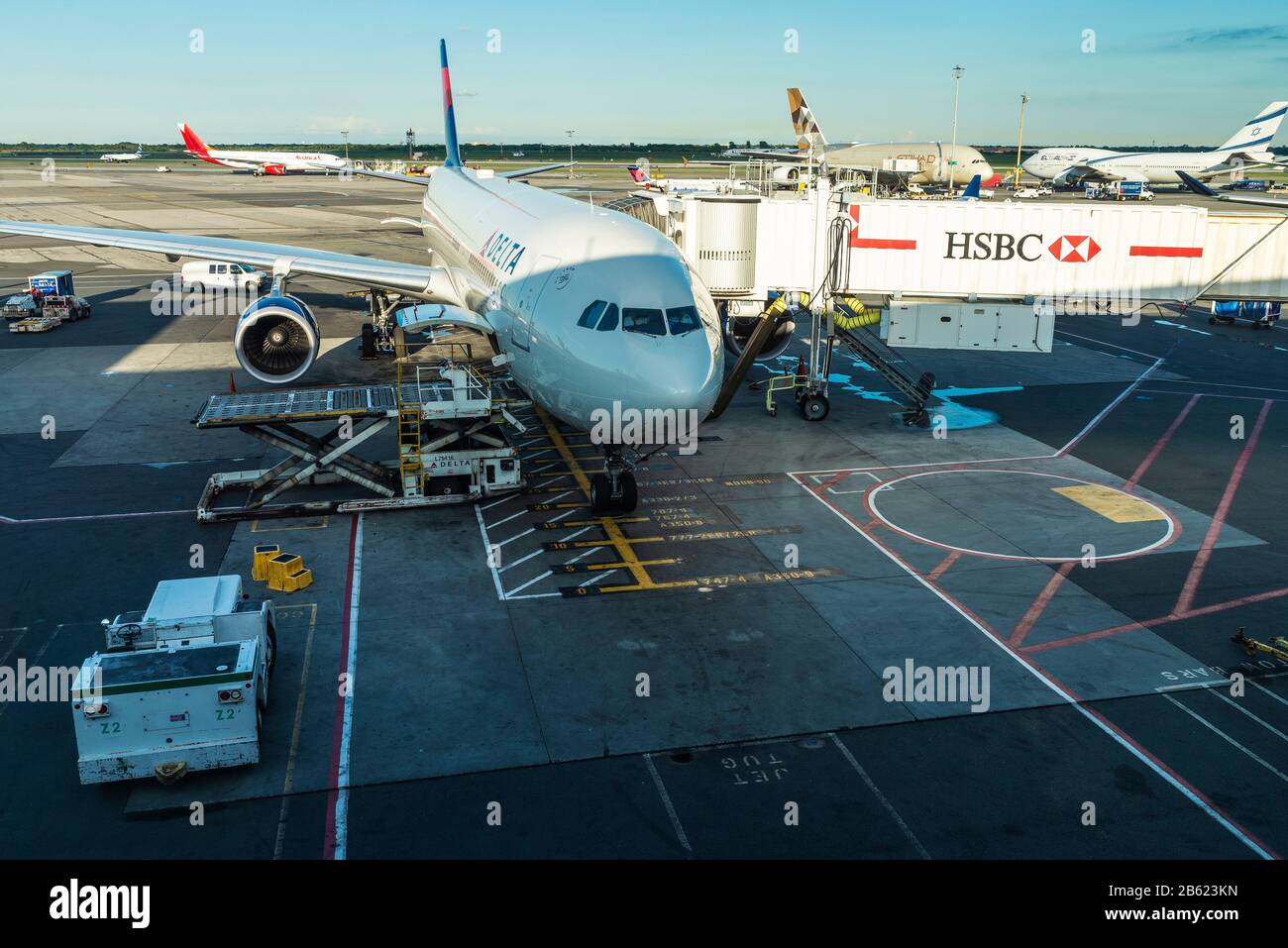 New York City, USA - August 4, 2018: Delta Air LInes airplane with a finger with HSBC advertising parked at John F. Kennedy International Airport (JFK Stock Photo