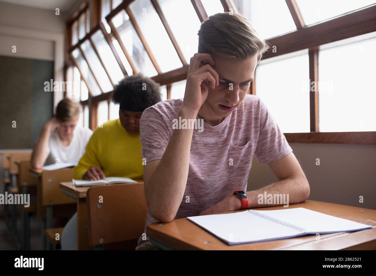Front view of students working in class Stock Photo