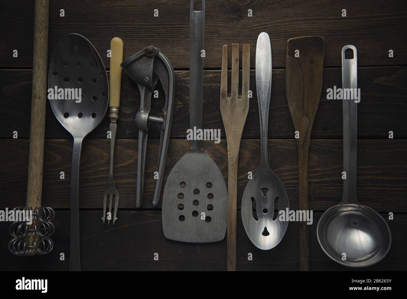 Collection of vintage cooking instruments on a rustic board Stock Photo Alamy