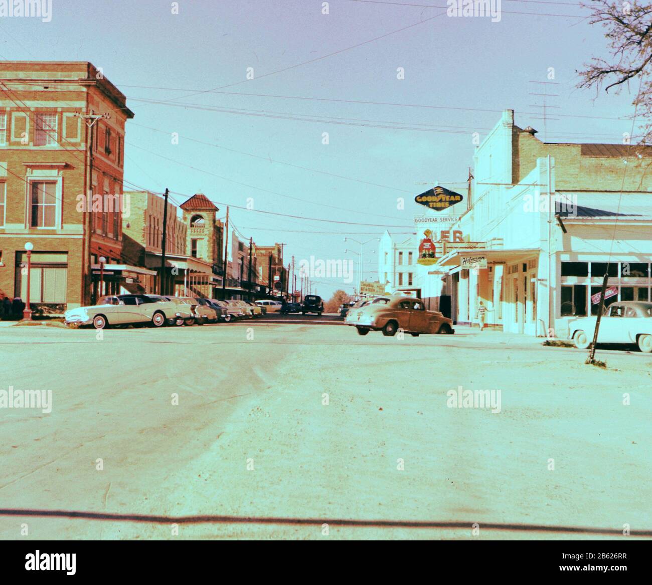 Cars parked on side of street in 1950s Lockhart Texas ca. 1957 Stock