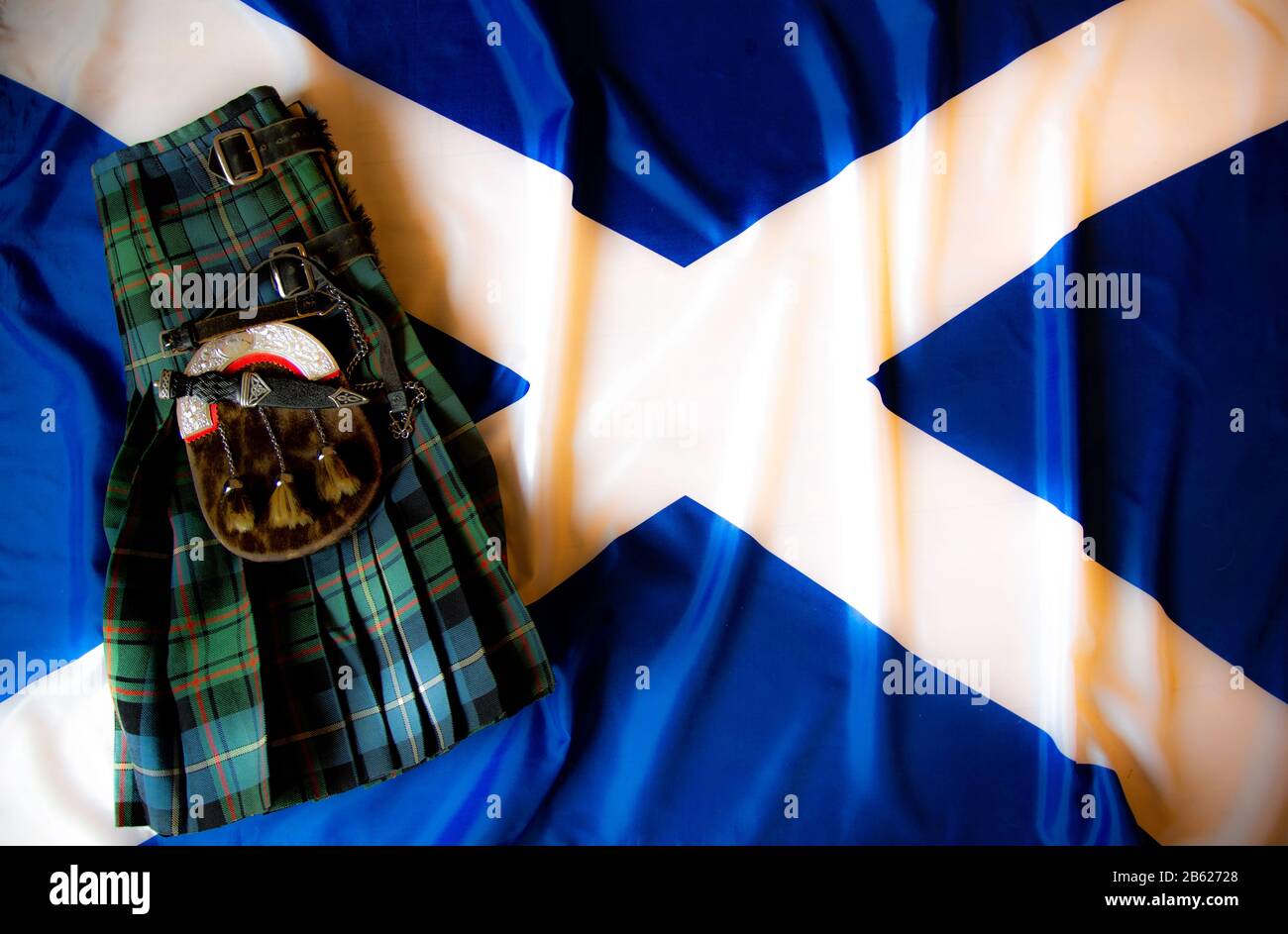 Scottish flag with kilt and tartan colours Stock Photo