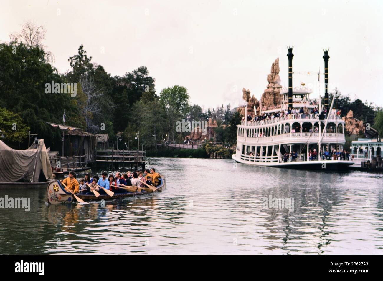 Canoe ride and Mark Twain Riverboat at Disneyland ca. 1986 Stock Photo