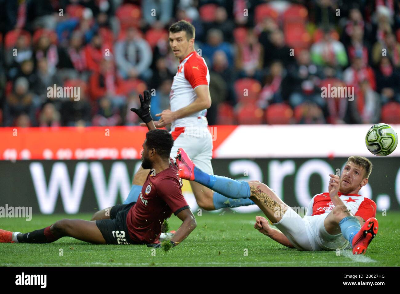 Prague, Czech Republic. 14th Apr, 2019. L-R Simon Deli (Slavia) and  Benjamin Tetteh (Sparta) are seen during the Czech first soccer league  (Fortuna Liga), 28th round, match SK Slavia Praha vs AC