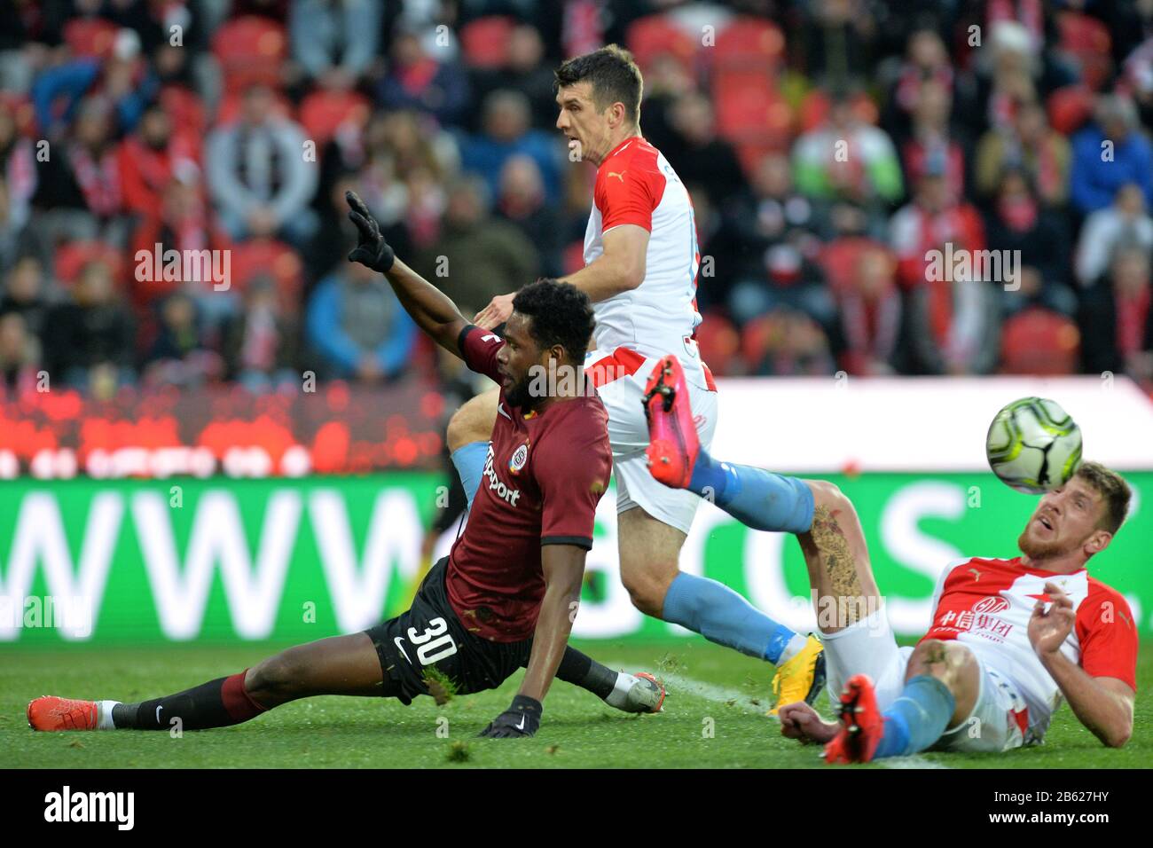 Prague, Czech Republic. 14th Apr, 2019. L-R Simon Deli (Slavia) and  Benjamin Tetteh (Sparta) are seen during the Czech first soccer league  (Fortuna Liga), 28th round, match SK Slavia Praha vs AC