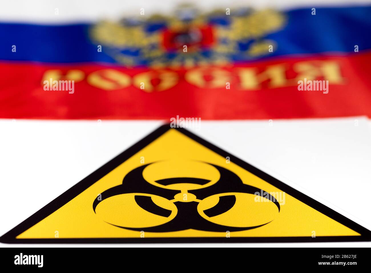 International biological hazard sign on the background of the flag of the Russian Federation Stock Photo
