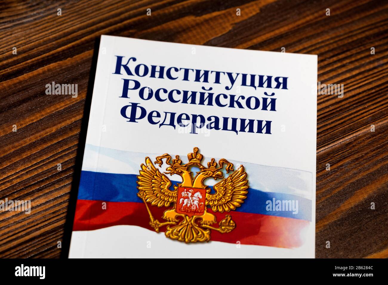 The brochure 'Constitution of the Russian Federation' are on a wooden table Stock Photo