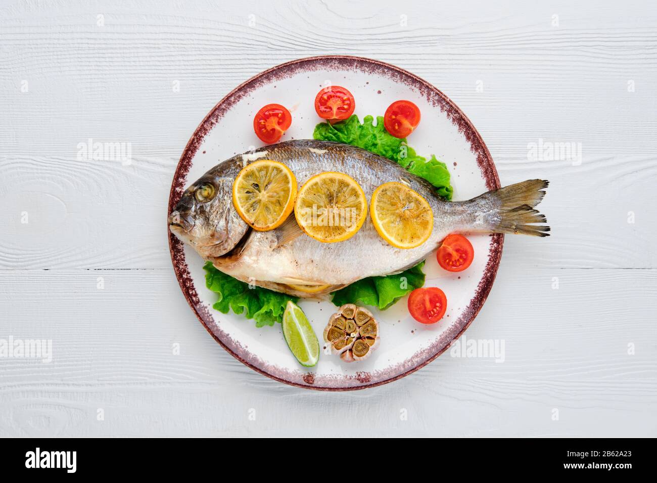 Overhead view of gilt head bream baked in oven Stock Photo