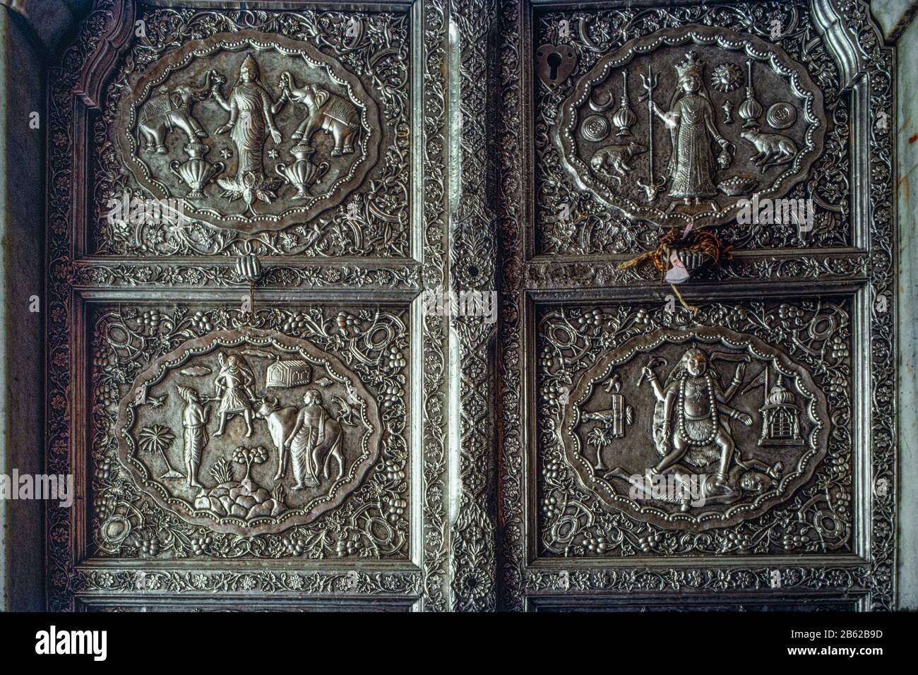 05 Mar 2020 God and Goddess embossed on silver door of Karni mata temple Bikaner Rajasthan India Stock Photo