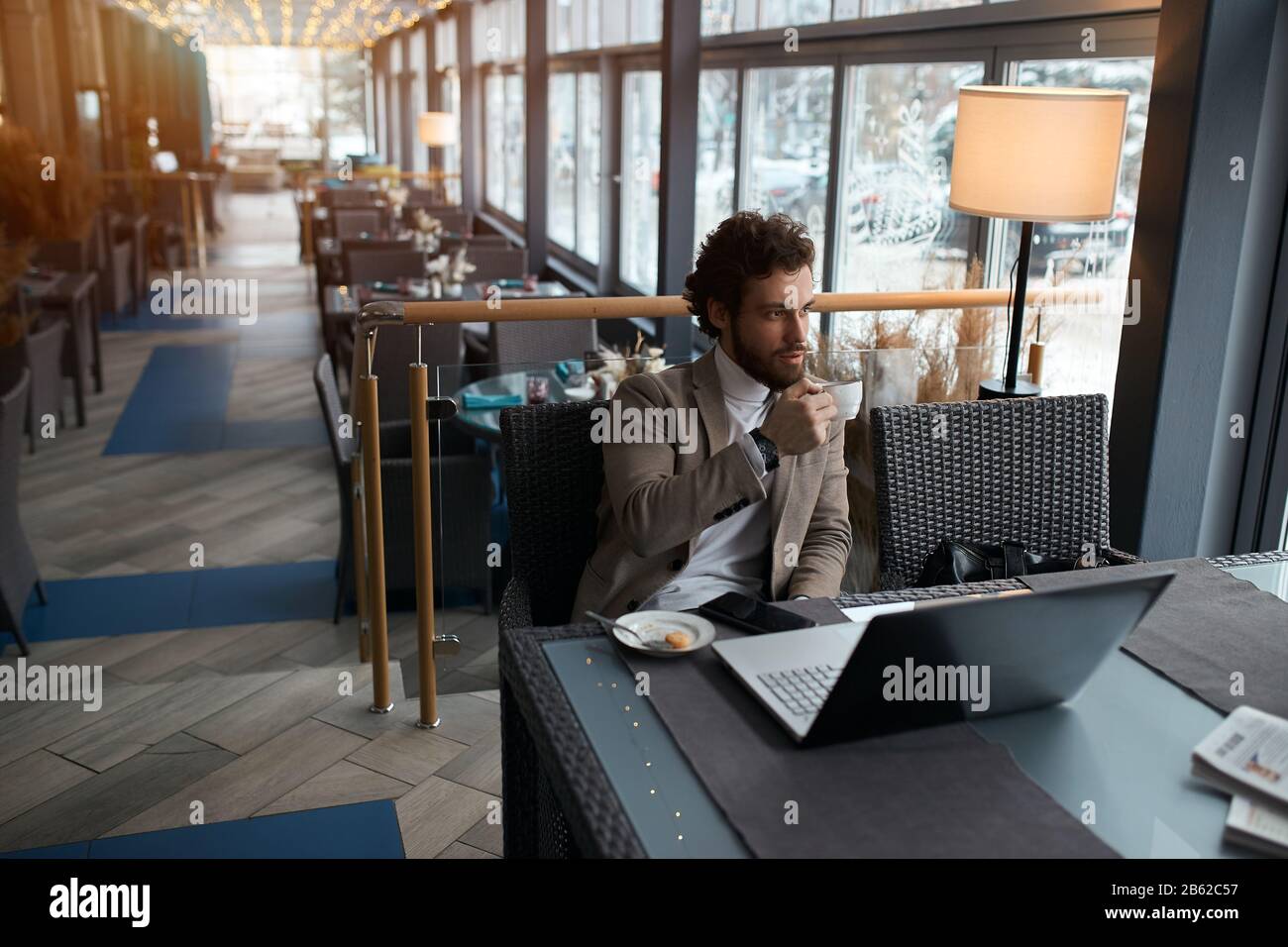 young businessman having breakfast, having a rest, relaxation, guy tasting coffee. close up photo Stock Photo