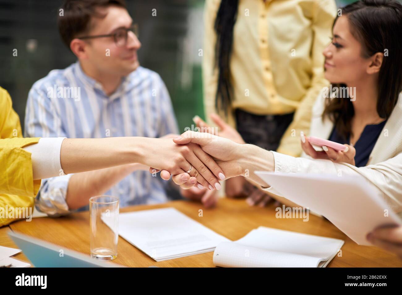 two companies negoataing a sale, bargain, business people are happy as they have closured of a deal. close up photo, successful signing a deal Stock Photo