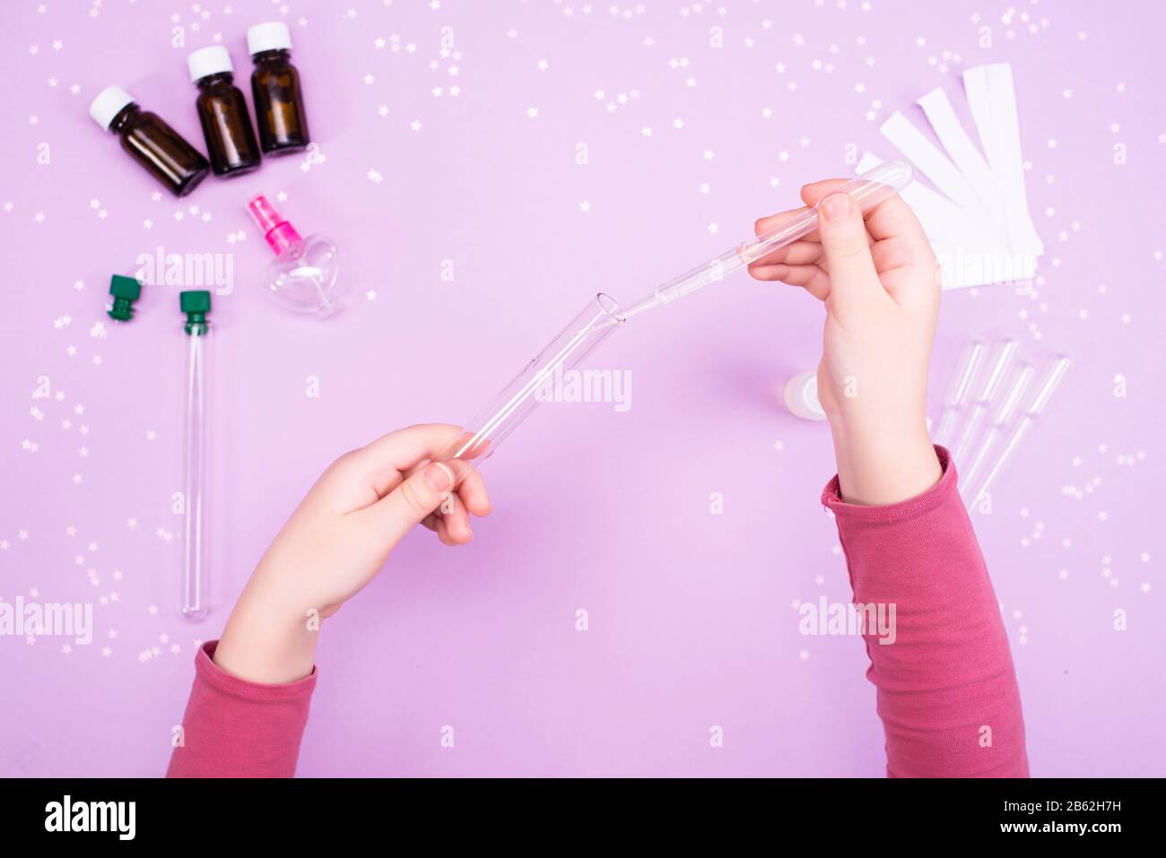 Making perfumes at home. Children's art project. Children's hands make