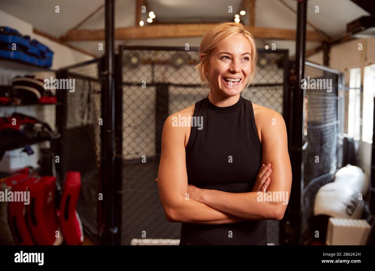 Portrait Of Female Mixed Martial Arts Fighter Training In Gym Stock Photo
