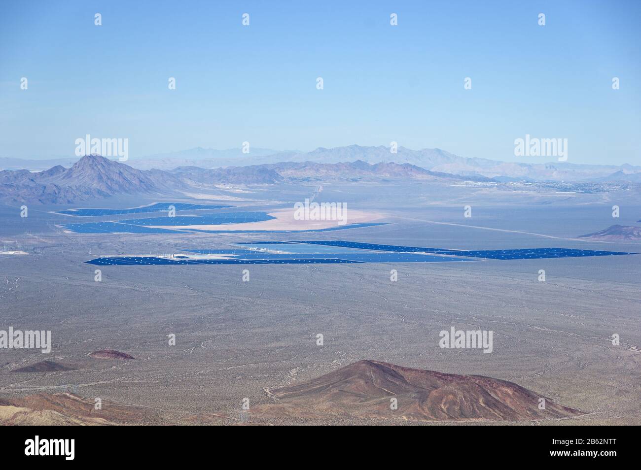 distant view of solar electric power plants in operation and under construction in the mojave desert south of Las Vegas including Nevada Solar One and Stock Photo