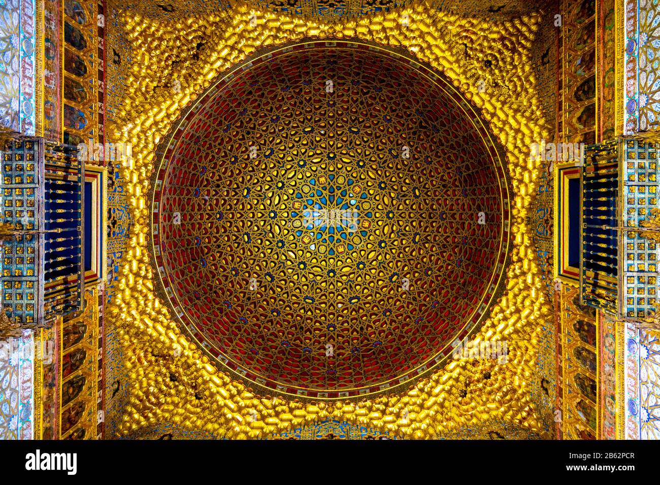 Ceiling cupola of the Hall of Ambassadors inside the Royal Alcázar of Seville, Spain Stock Photo