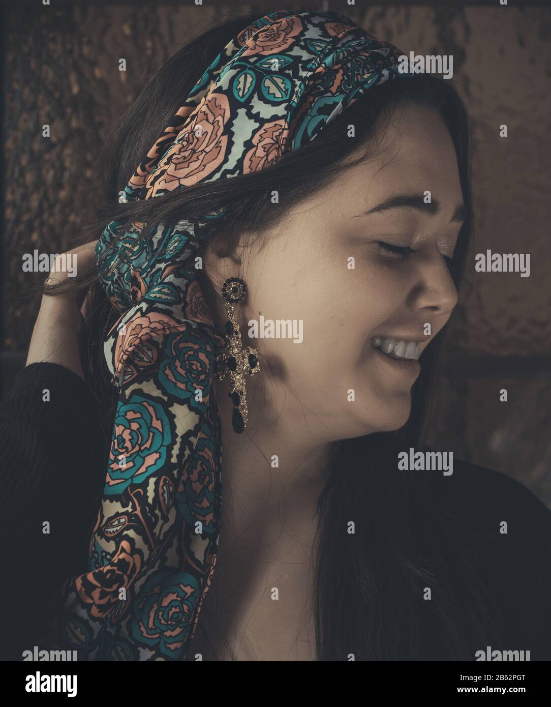 Young woman laughing with eyes closed. Stock Photo