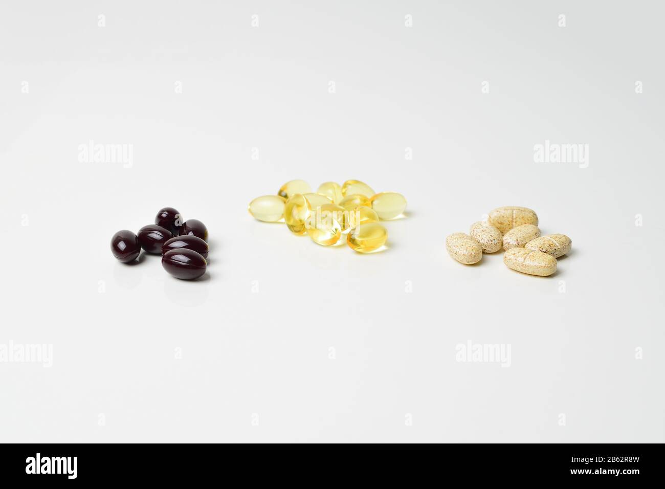 Bunches of multivitamins, fish oil and astaxanthin. Polyunsaturated