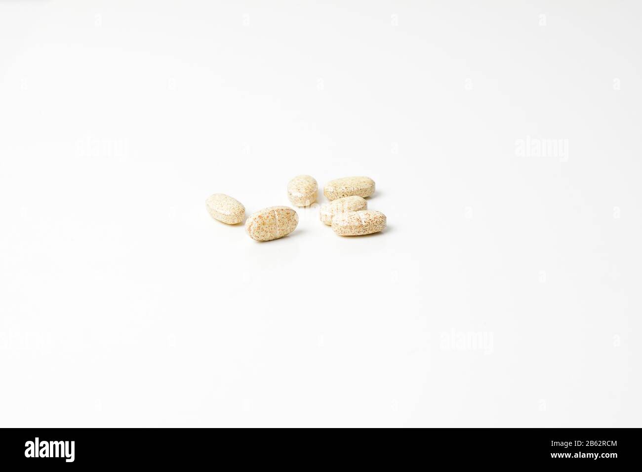 Multivitamin pills on a white background. Stock Photo