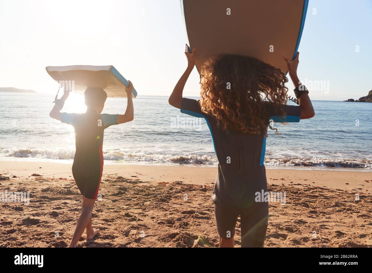 Three friends sea bodyboards hires stock photography and images Alamy