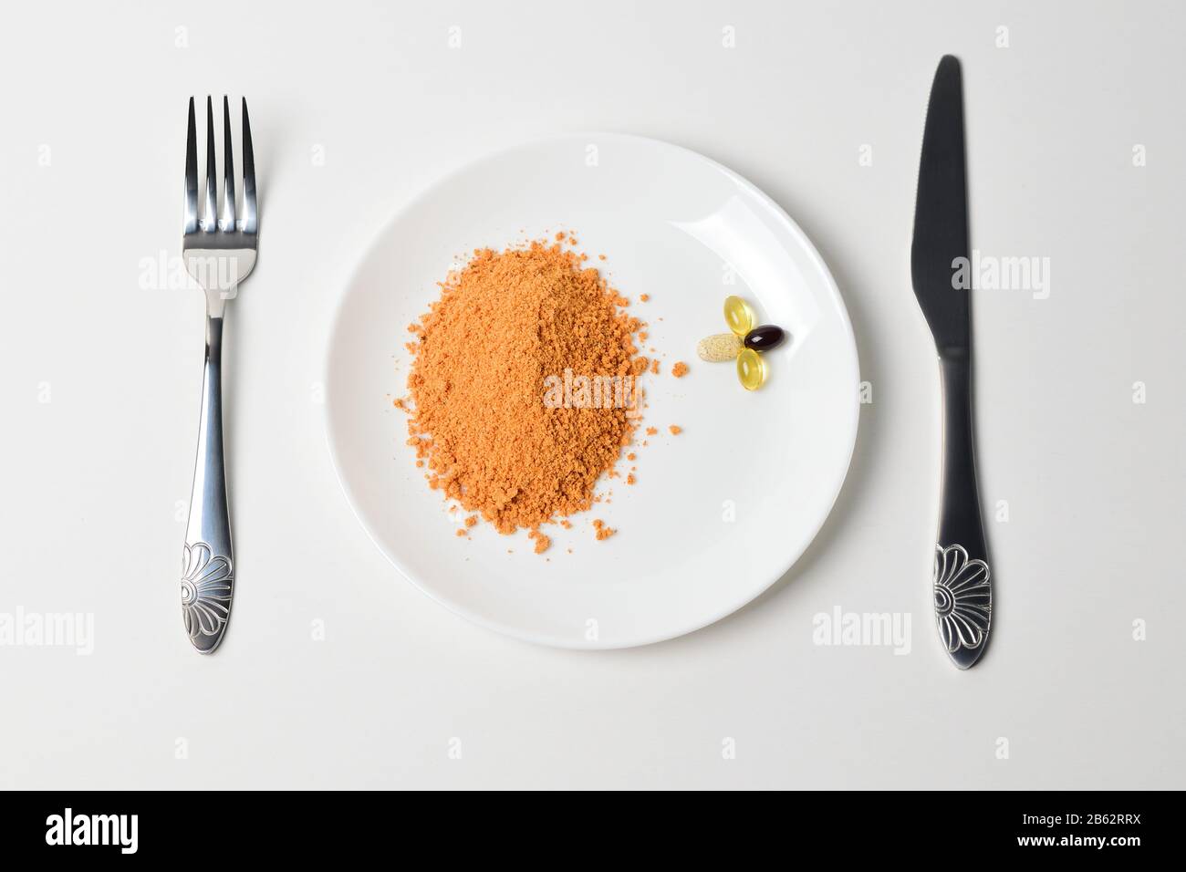 Meal replacement. Protein powder on a plate. Dry soup. Multivitamins