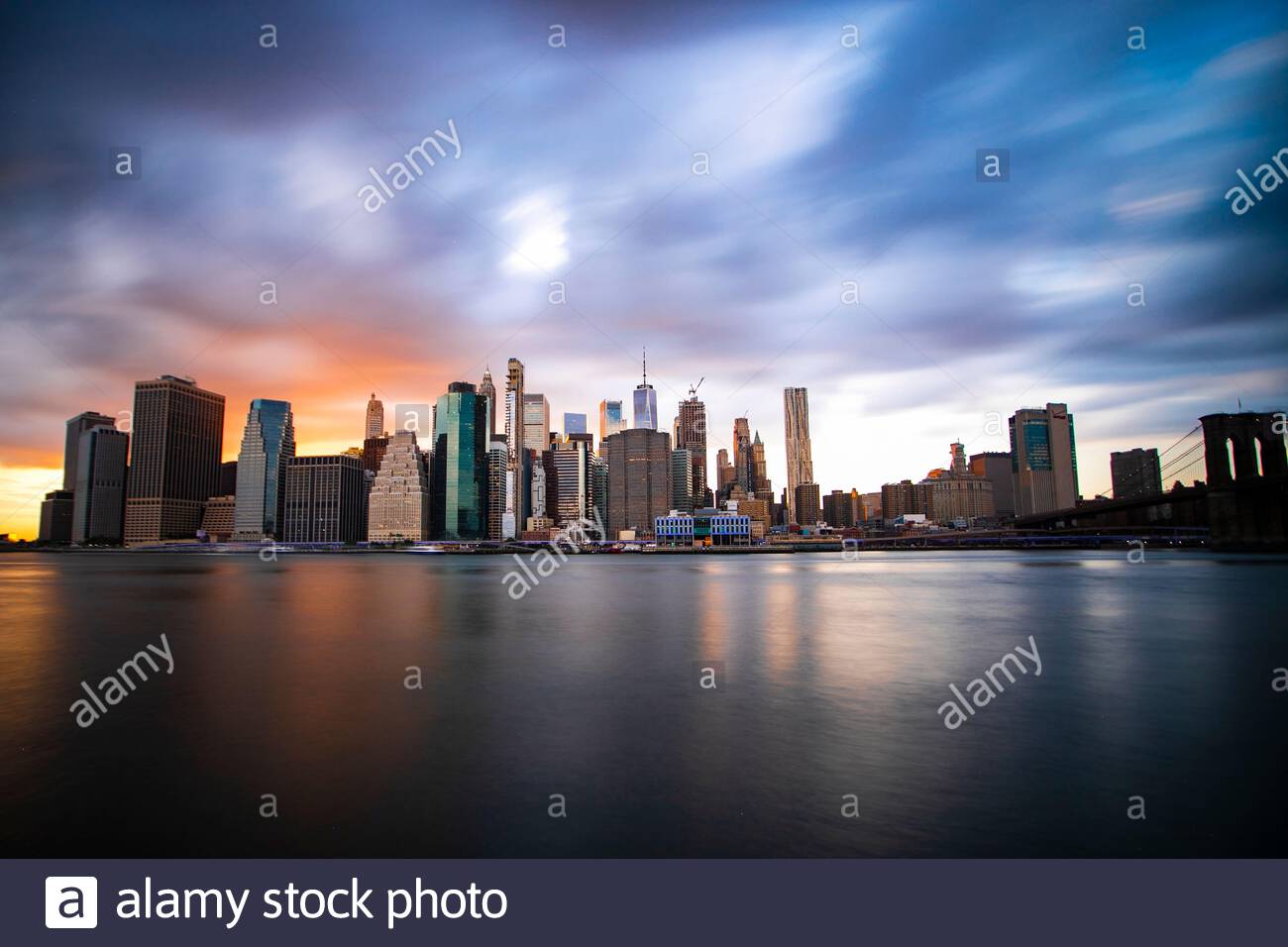 New York City, Lower Manhattan, view from Brooklyn Bridge Park at sunset Stock Photo