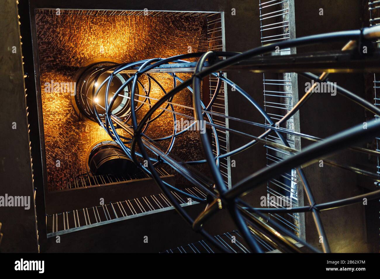 Futuristic design of elevator shaft with steel and stone structures Stock Photo