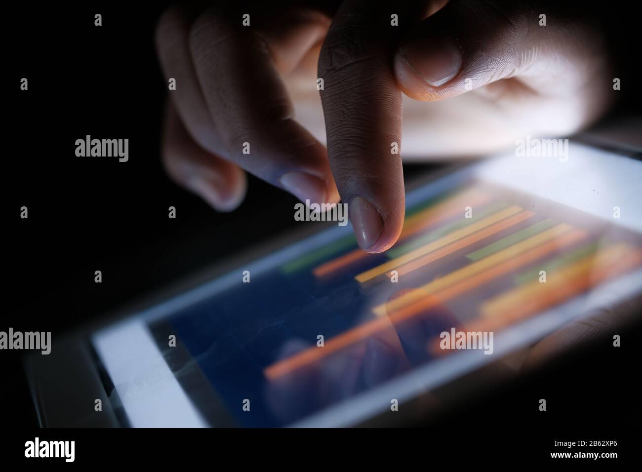 Close up of man hand analyzing chart on digital tablet Stock Photo - Alamy