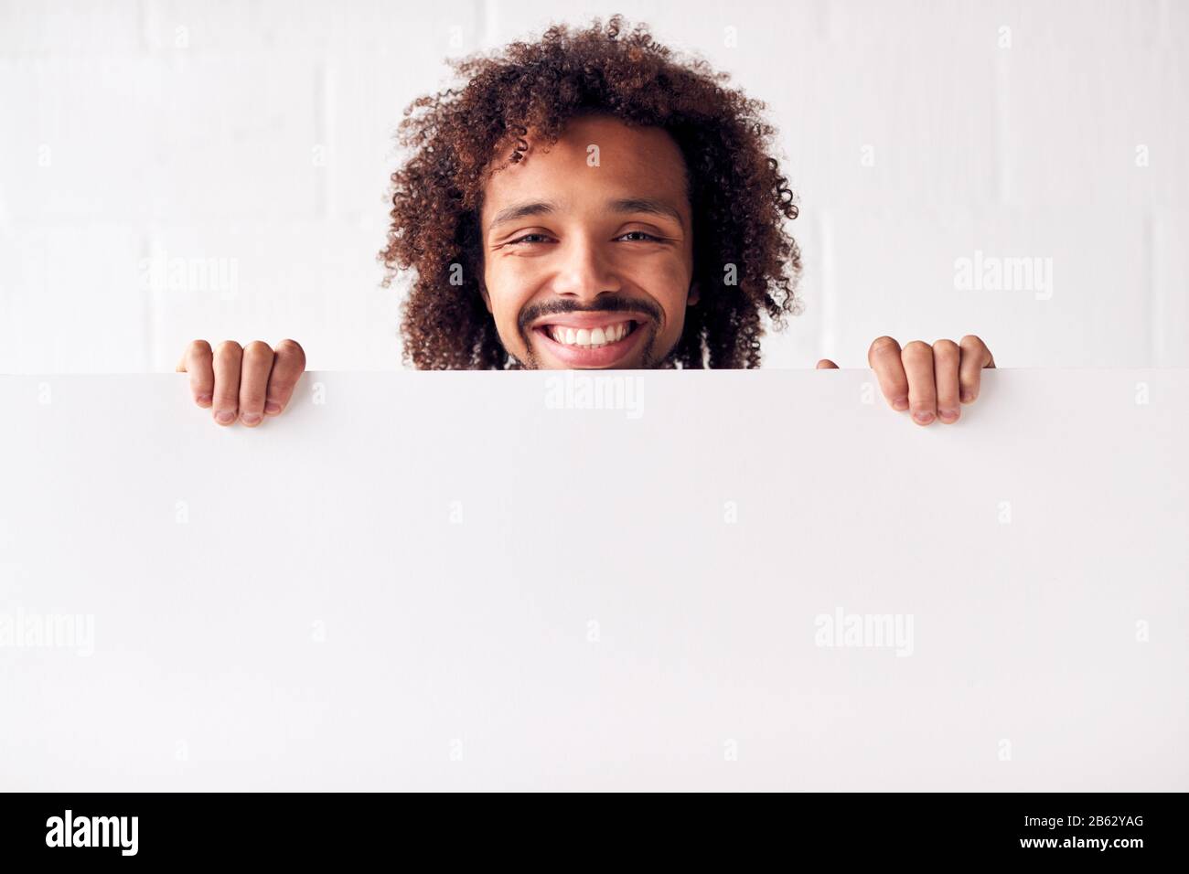 Portrait Of Happy Young Man Holding Blank White Card With Copy Space ...
