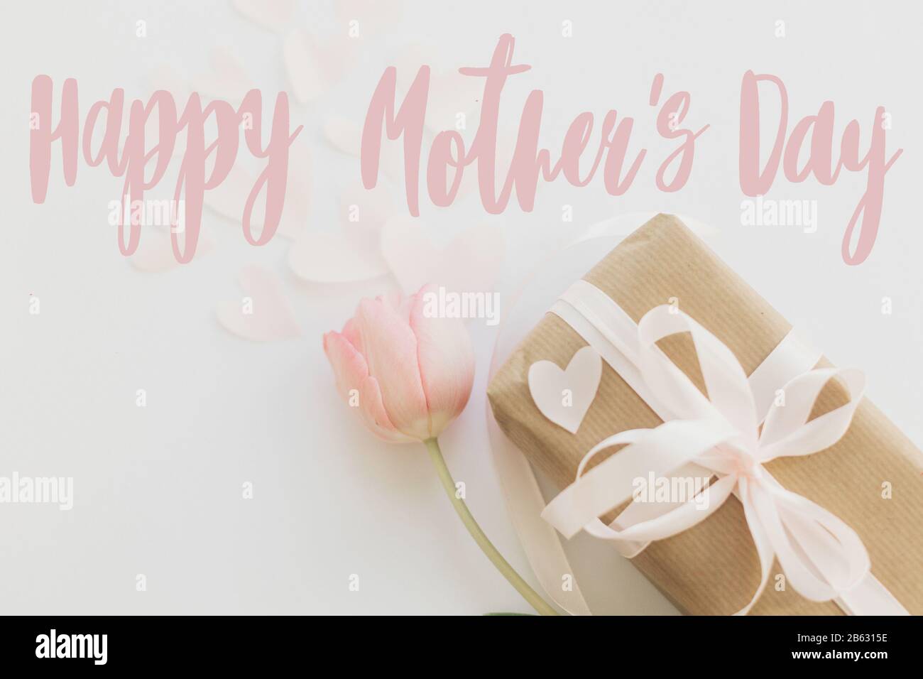 Happy mother's day. Happy mother's day text and pink tulips with gift ...