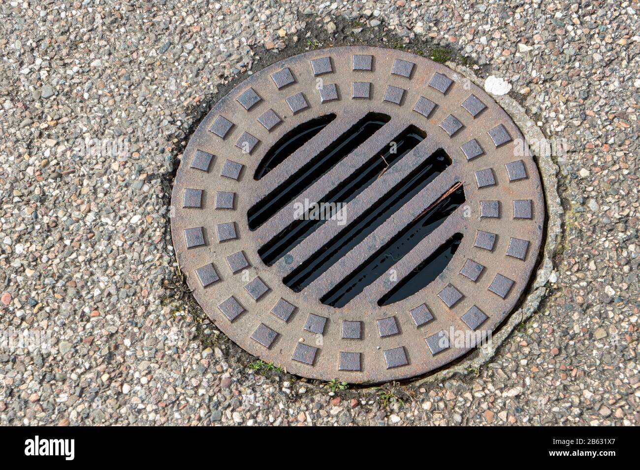 small round steel manhole cover for rainwater drainage Stock Photo