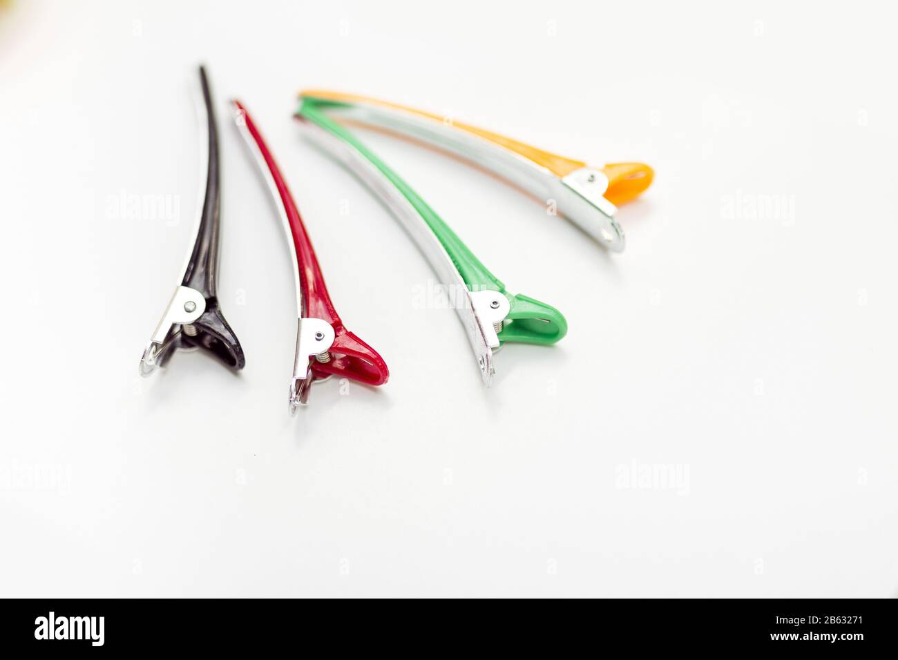 Colored hair clips isolated on white background Stock Photo - Alamy