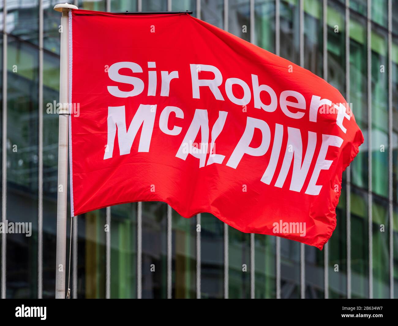 Sir Robert McAlpine Construction - flag outside a Sir Robert McAlpine Limited building site in Central London, founded in 1869 Stock Photo
