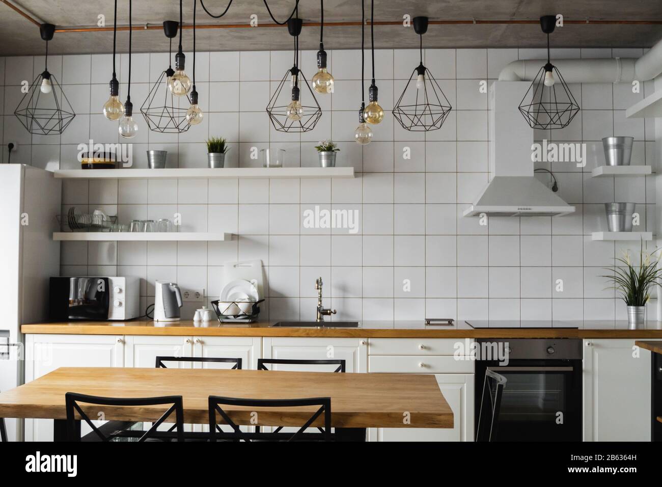 Modern, bright, clean, kitchen interior with stainless steel appliances ...