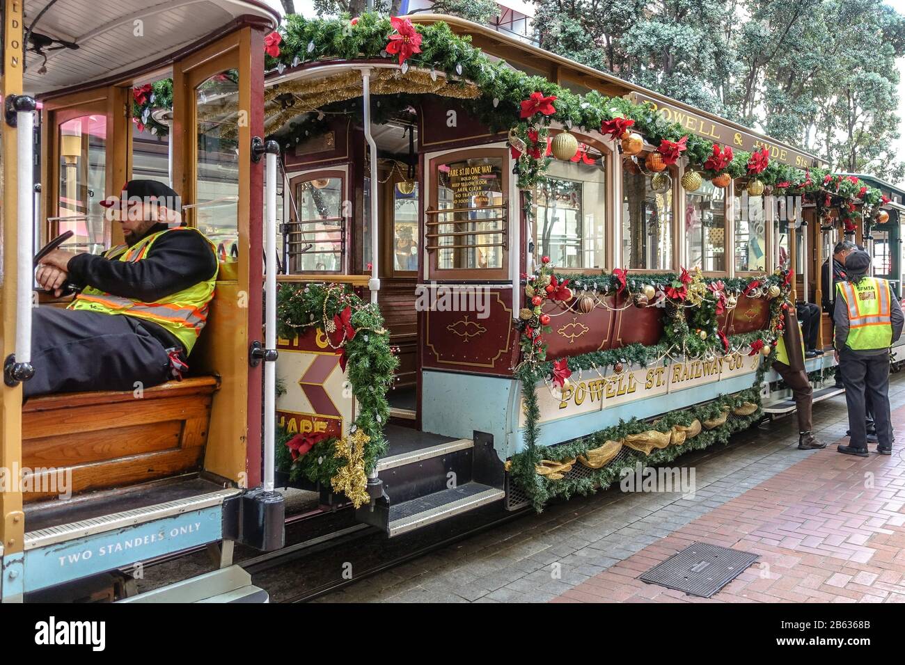 A San Francisco cable car decorated for Christmas waits in the station Stock Photo