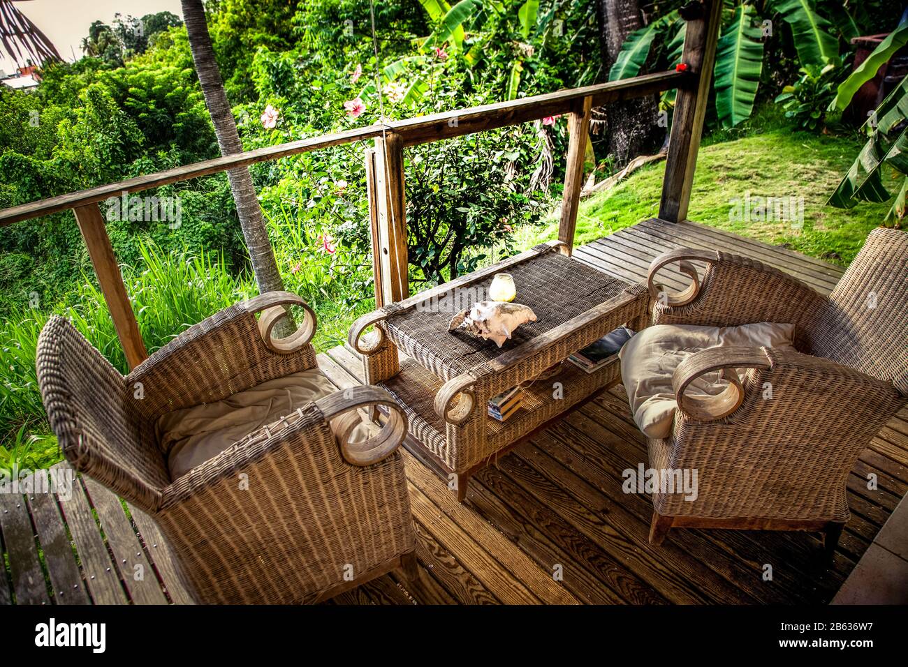 wooden terrace with chairs in a tropical garden Stock Photo - Alamy