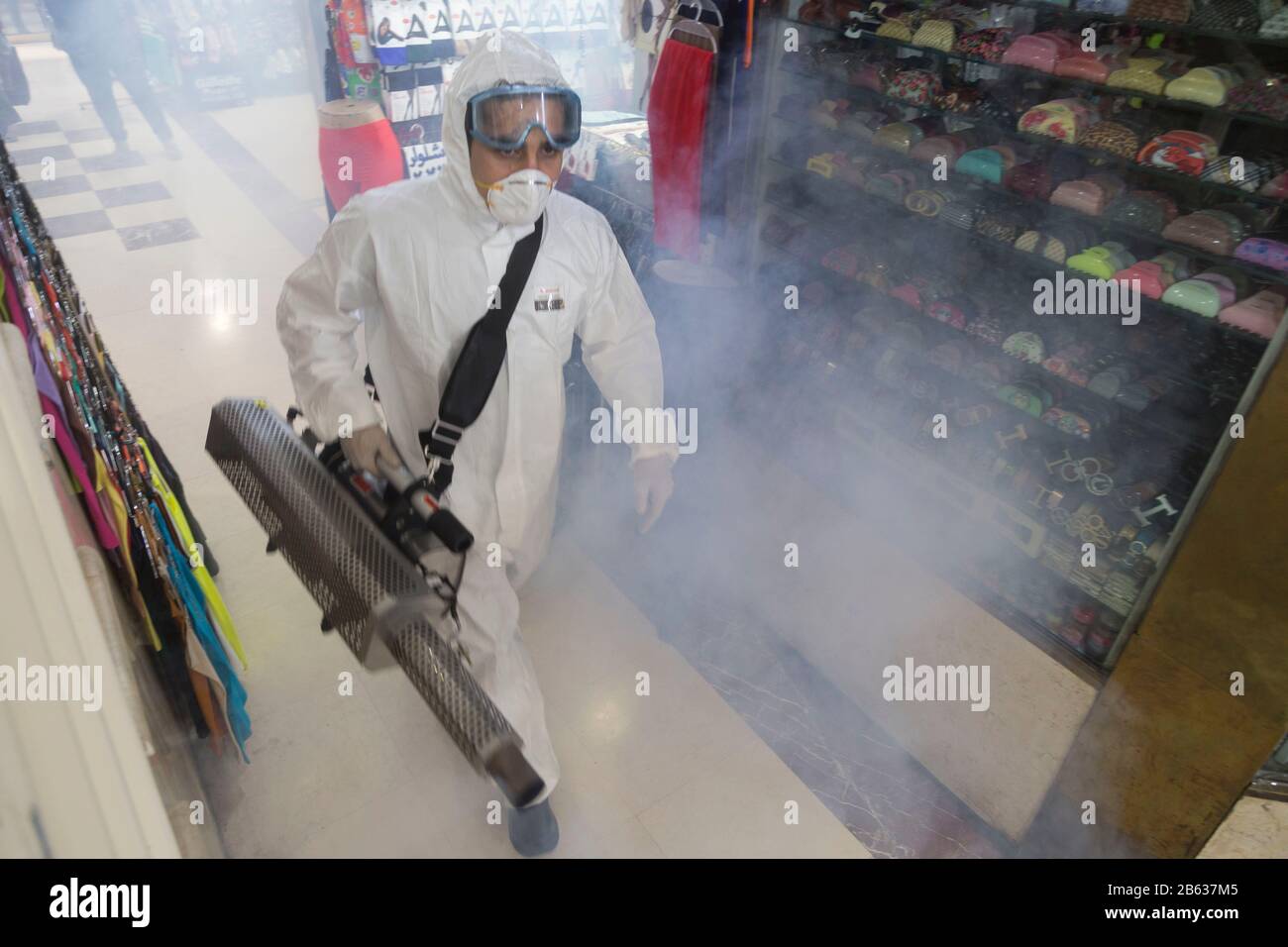 Tehran, Iran. 6th Mar, 2020. Firefighter teams with protective suits disinfect the Tajrish Bazaar shopping center as a precaution to the coronavirus (Covid-19) in Tehran. Iranian officials canceled Friday prayer for the second week due to concerns over the spread of coronavirus and COVID-19. According to the last report by the Ministry of Health, there are 4,747 COVID-19 cases in Iran. 147 people have died so far. A Health Ministry spokesman warned authorities could use unspecified 'force' to halt travel between major cities. Credit: Rouzbeh Fouladi/ZUMA Wire/Alamy Live News Stock Photo