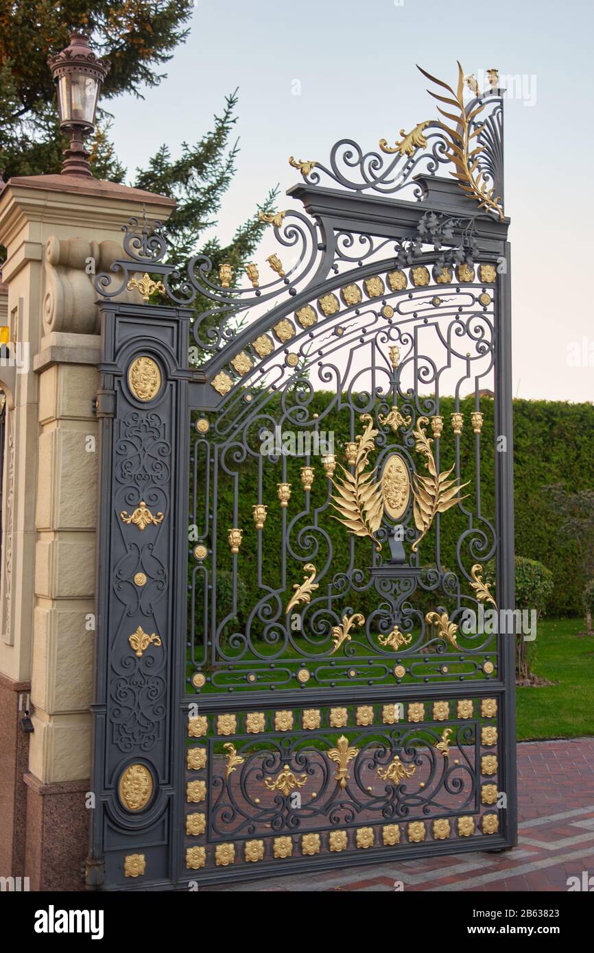 Opened decorative garden park gate Stock Photo - Alamy