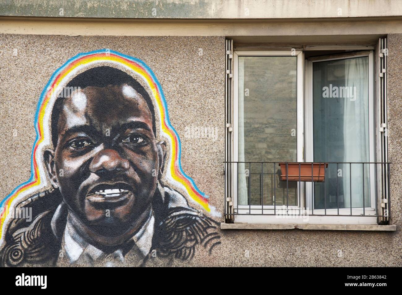 Portrait of a young black man painted on the wall of an apartment building near the Butte aux Cailles district of Paris. By street artist Ernesto Novo. Stock Photo