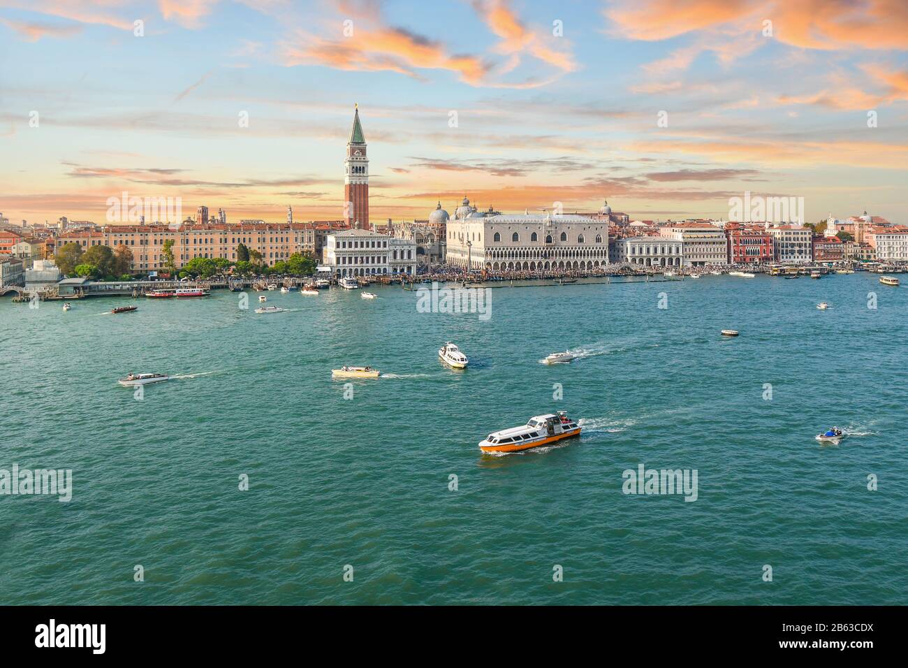 Sunset aerial view of the Grand Canal and Giudecca Canal converging in front of Piazza San Marco, Campanile tower and Doge's Palace in Venice, Italy Stock Photo