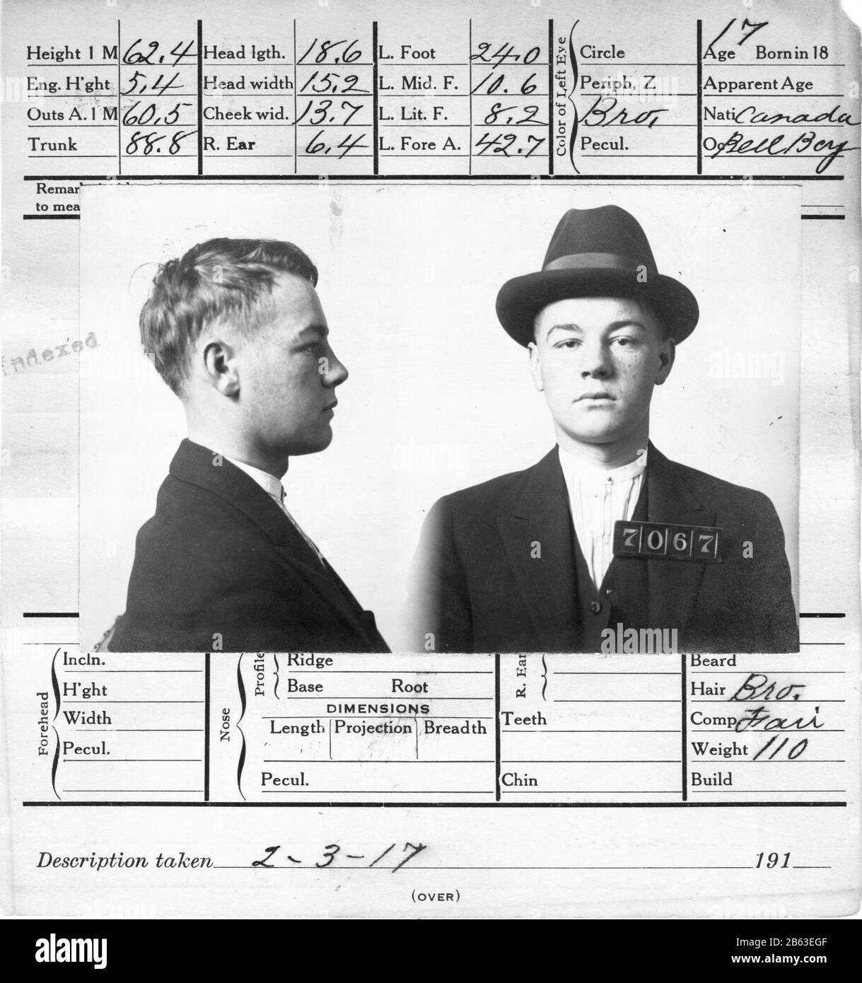 Edwardian era mugshot of 17-year-old criminal in San Franciso, California. Front and side headshots of this man. At the time of his arrest, he was working as a Bell Boy. He was convicted of burglary. This official 5-1/2' x 6' card was filled out on February 3, 1917. Look at the extensive amount of measurements they did on this man's head. This young man from Canada is wearing a hat. Look at the extensive amount of measurements they did on his head. More info about the man is on the back of this 5-1/2' x 6' card.  To see my other vintage images, Search:  Prestor  vintage  odd Stock Photo