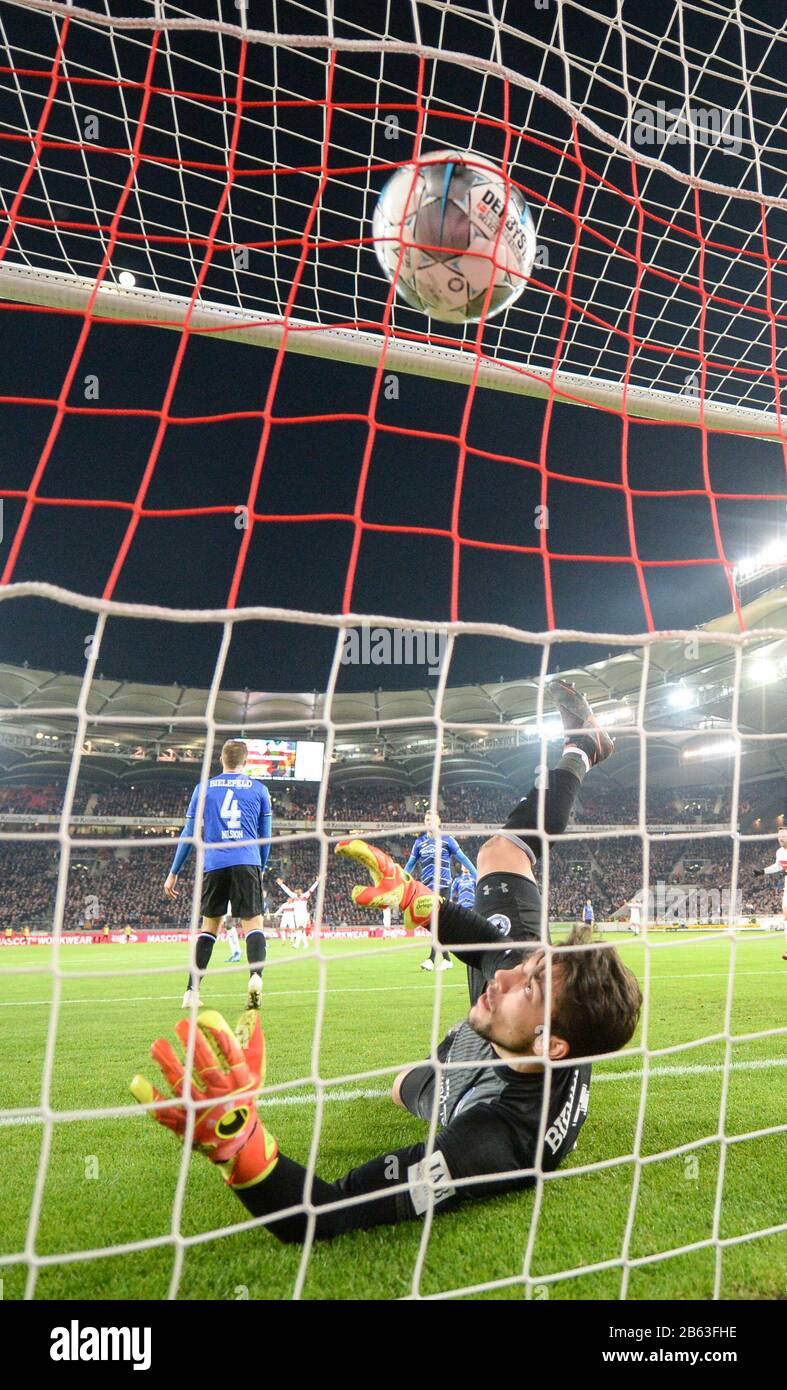 Munich's goalkeeper Stefan Ortega Moreno (R) catches the penalty shot by  Andreas Geipl of Regensburg (2-R) during the 2. Bundesliga relegation match  between Jahn Regensburg and TSV 1860 Munich at the Continental