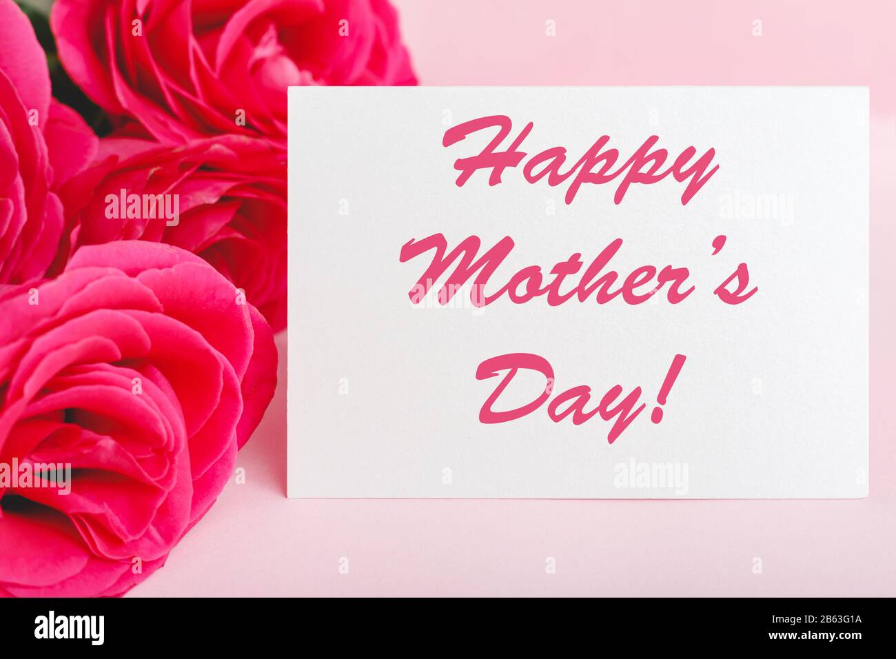 Happy Mothers Day text on gift card in flower bouquet of pink roses on ...
