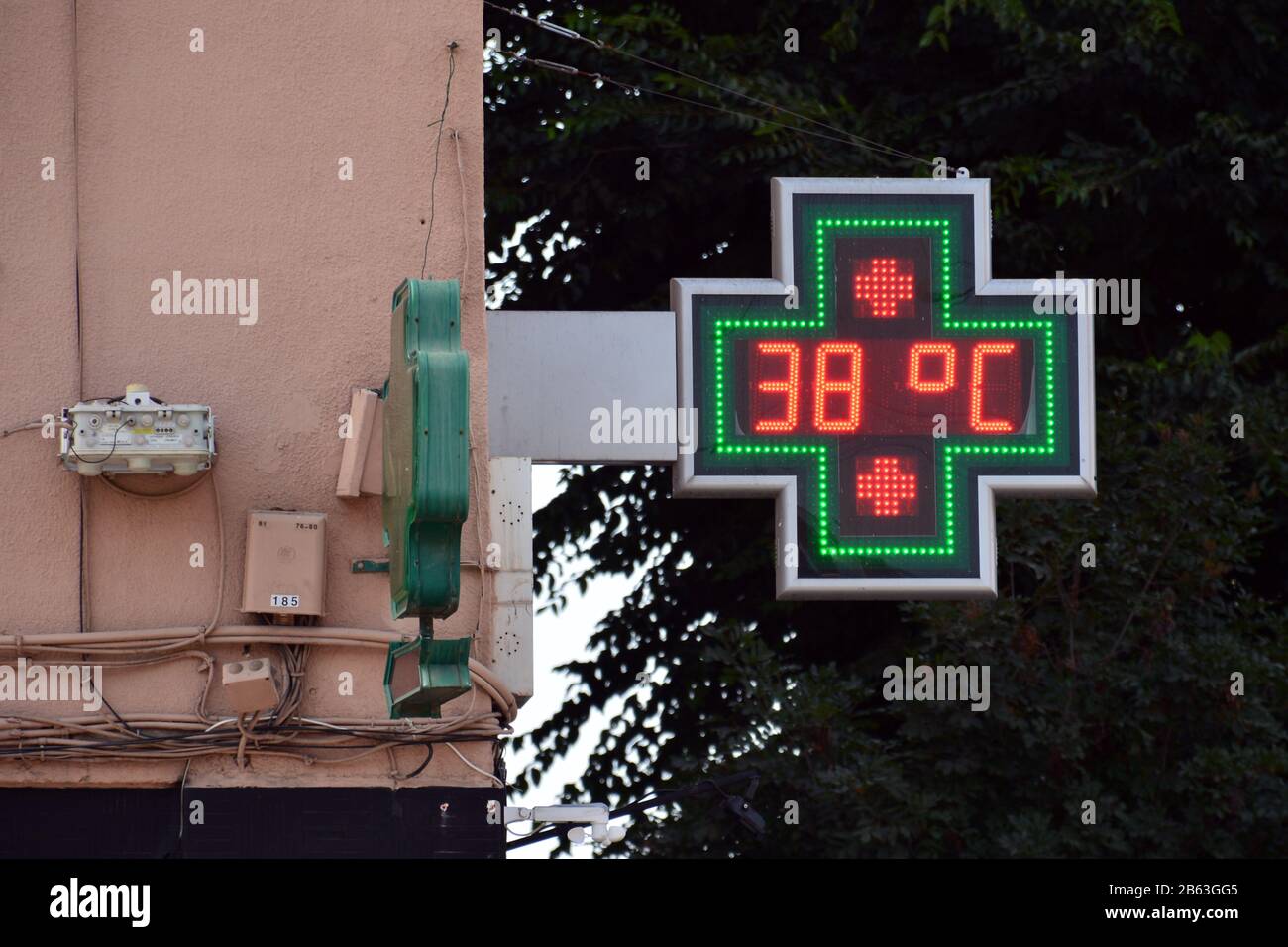 street thermometer of a pharmacy at 38 degrees celsius Stock Photo