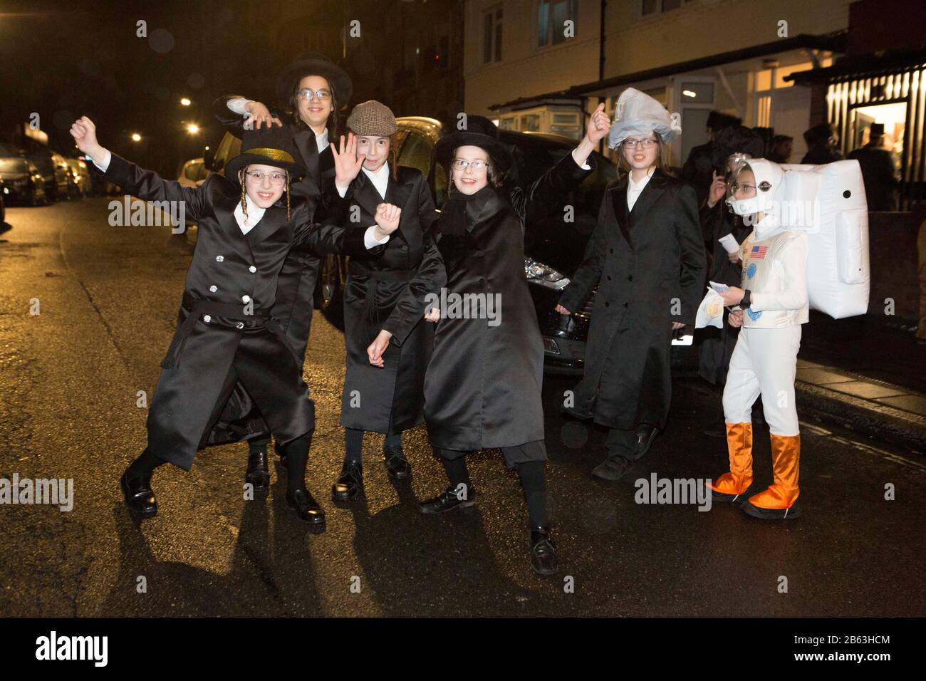 London, Stamford Hill, UK. 9th March 2020. Ultra-Orthodox Jewish children dressed in fancy dress to celebrate the Jewish Purim holiday in Stamford Hill area of London. The festival involves the reading of the Book of Esther, describing the defeat of Haman, the Persian king's adviser, who plotted to massacre the Jewish people 2,500 years ago, an event that was prevented by Esther’s courage. Credit: Marcin Nowak/Alamy Live News Stock Photo